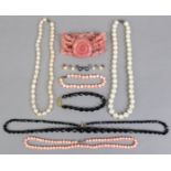 Two pearl necklaces, 43cm & 42.5cm long; a coral necklace, 40cm long; a jet necklace, 60cm long,