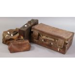 A vintage tan leather suitcase fitted brass twin-lever locks, 55.5cm wide; together with two fibre-