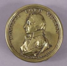 An early 19th century brass snuff box commemorating Admiral Lord Nelson, with titled portrait to the