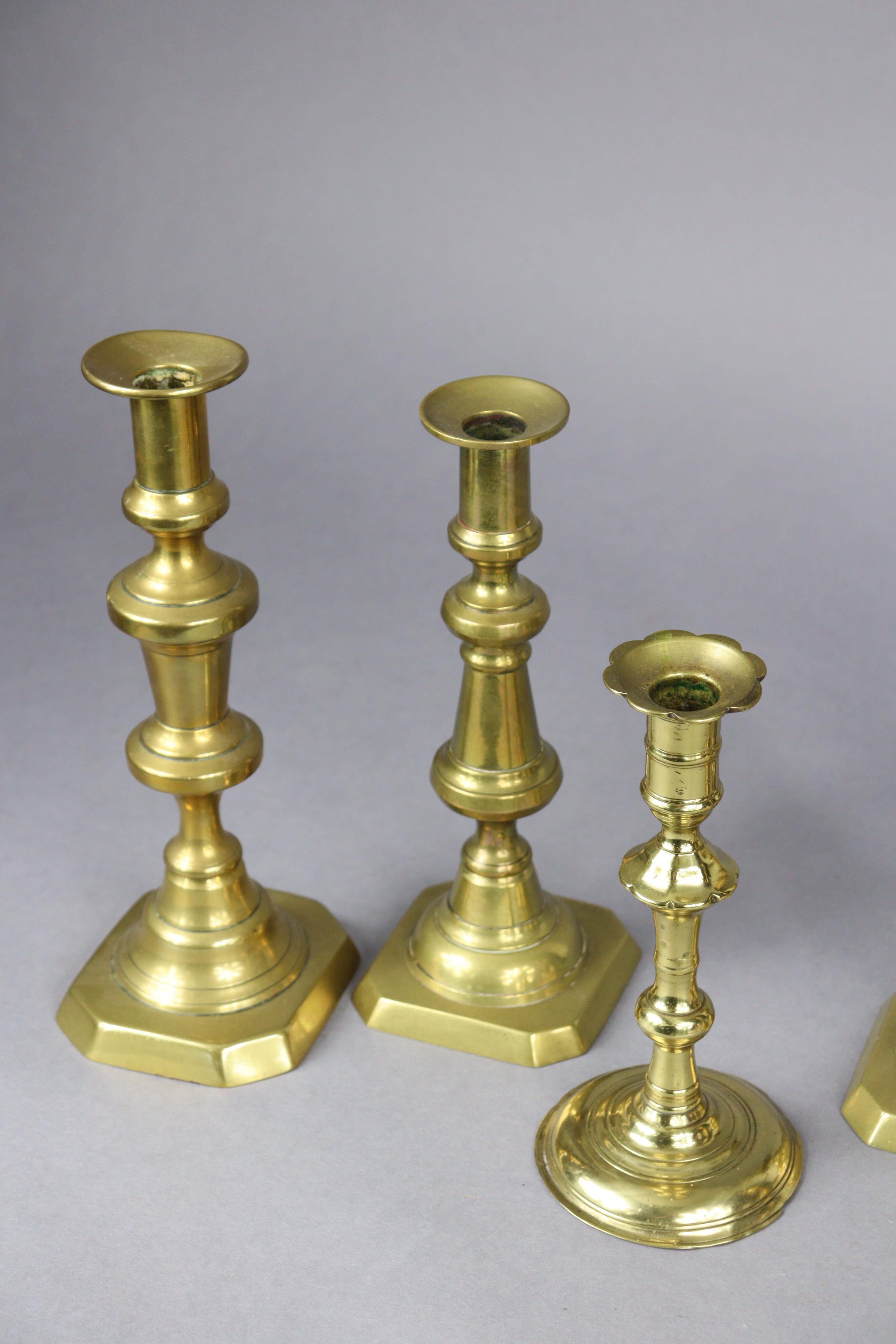 An 18th century brass candlestick, 20cm high; two pairs of Victorian candlesticks, 26.5cm & 24.5cm - Image 7 of 8