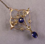 An early 20th century 9ct gold openwork brooch set round-cut sapphire & seed pearls, an oval-cut