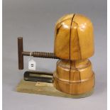 A late 19th/early 20th century milliner’s wooden adjustable hat stretcher with iron mechanism & side