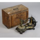 A vintage Jones serpentine cat-back sewing machine with gilt foliate decoration, 38cm wide, with