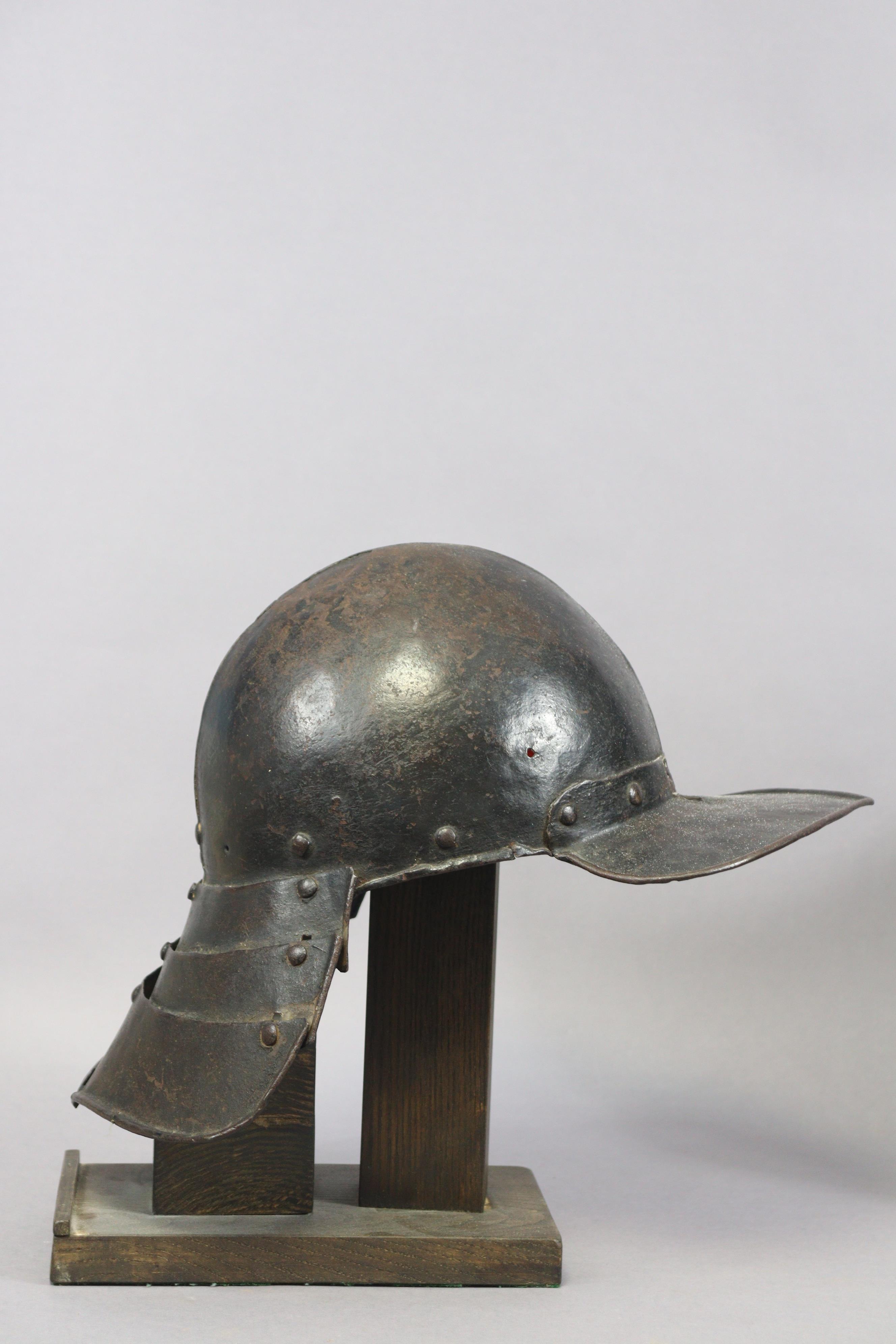An English Civil War period lobster-tail steel helmet & breastplate, the pot helmet of typical form, - Image 3 of 11