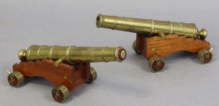 A pair of brass cannons, each inscribed “W. NORTH 1848” & with a military arrow, & each mounted on