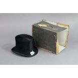 A black silk top-hat, bears label “Lincoln Bennette & Co. London”, with hatbox (hatbox w.a.f.).