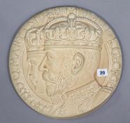 A Burleigh ware pottery circular wall plaque commemorating the silver Jubilee of King George & Queen