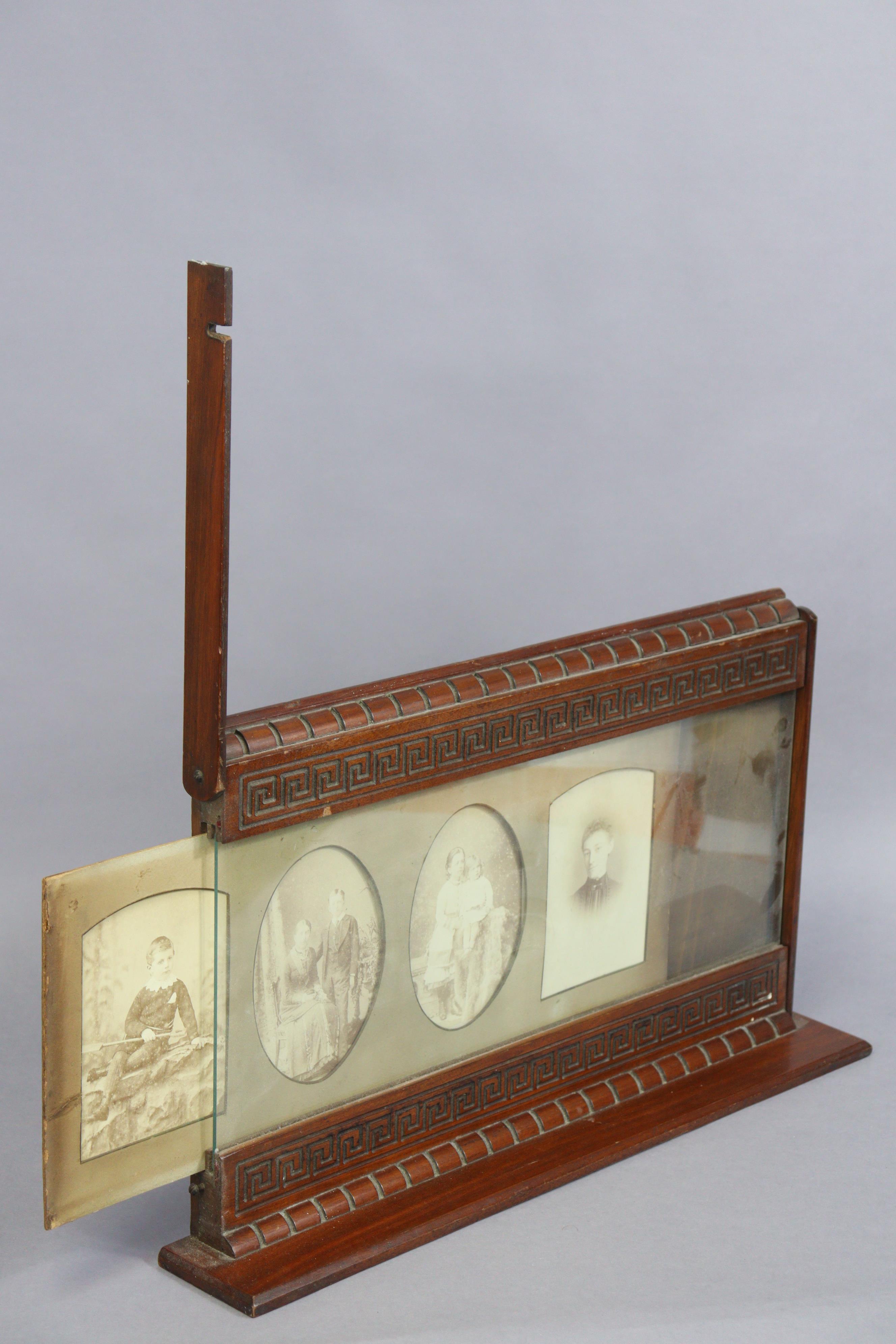 A late 19th/early 20th century carved mahogany table standing photograph frame, 54cm wide x 31cm - Image 4 of 6