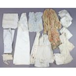 Ten Edwardian white cotton nightgowns; a white tablecloth, etc.