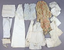Ten Edwardian white cotton nightgowns; a white tablecloth, etc.
