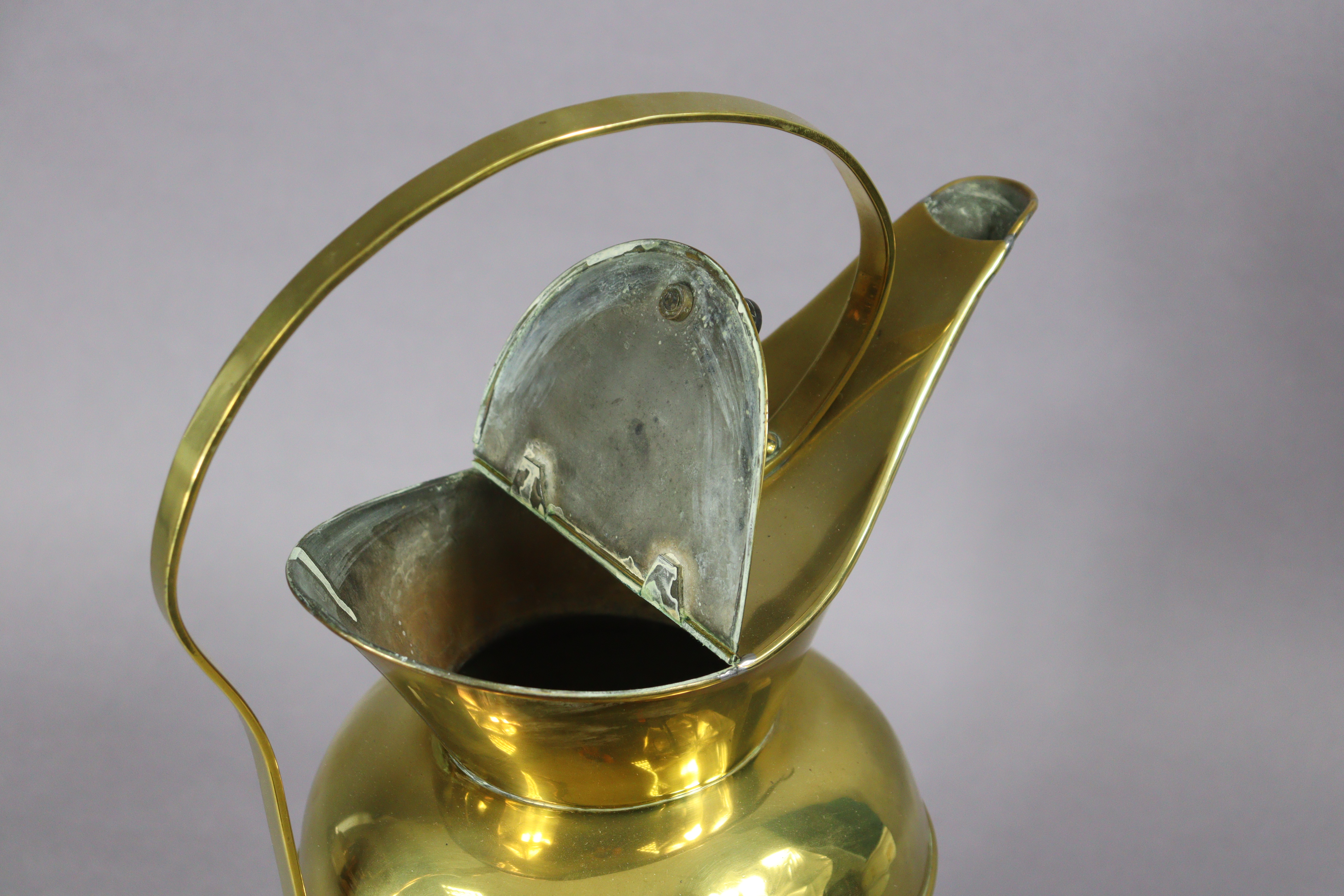 A late 19th century brass water jug designed by Christopher Dresser for Benham & Froud, with - Image 4 of 7