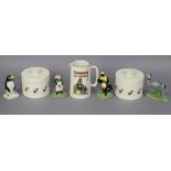 Four carlton ware “ Guiness” advertising figures, a pair of ditto cylindrical storage jars, and a “