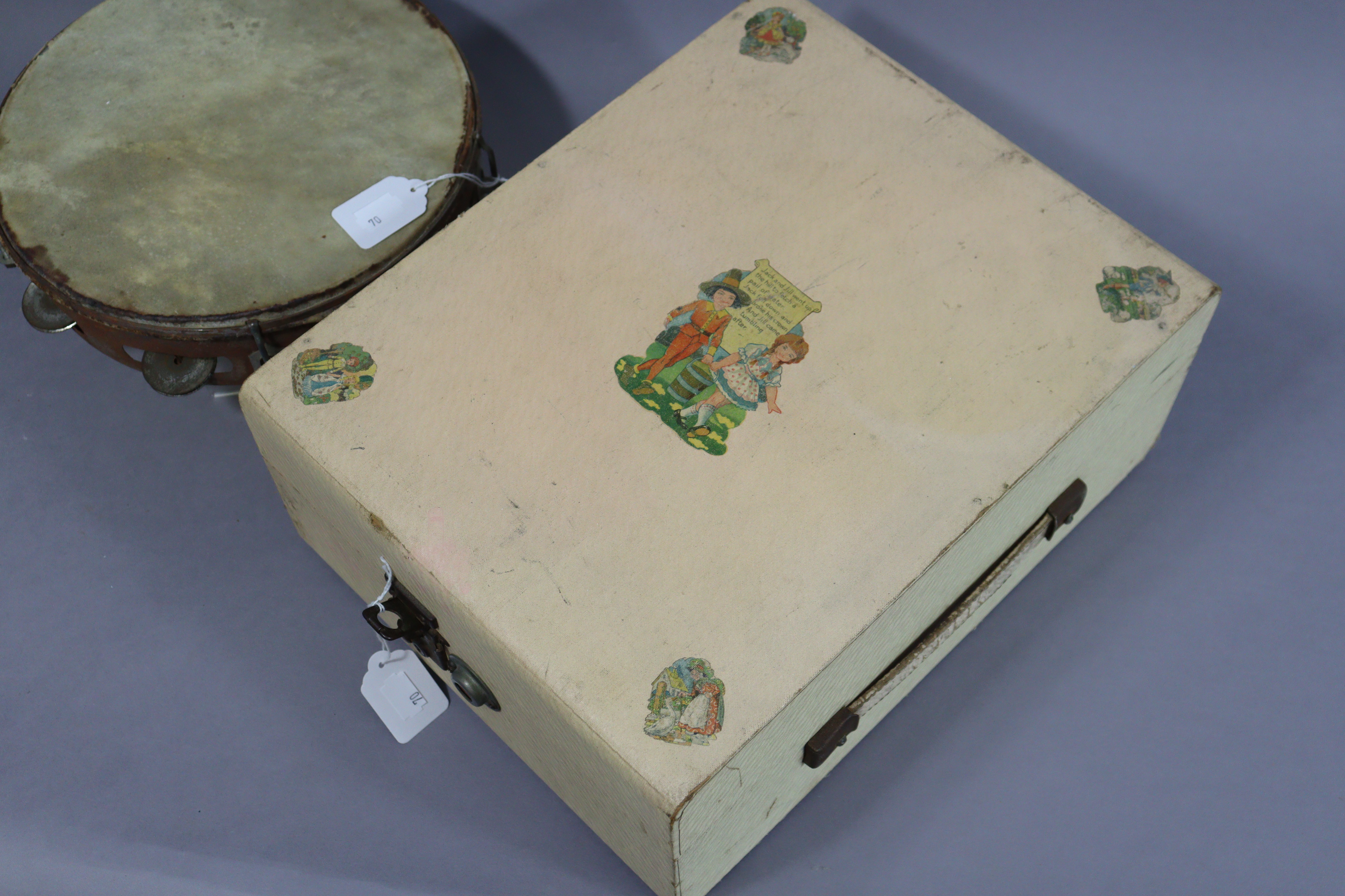 A Ridgmount portable gramophone in a cream finish fibre-covered case; together with a tambourine. - Image 4 of 7