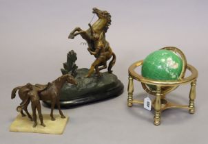 A small geological specimen globe, 24cm diameter; a Spelter Marley horse ornament, 29cm high; & a