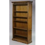 An Old Charm tall oak standing open bookcase with five various adjustable & fitted shelves; & on a