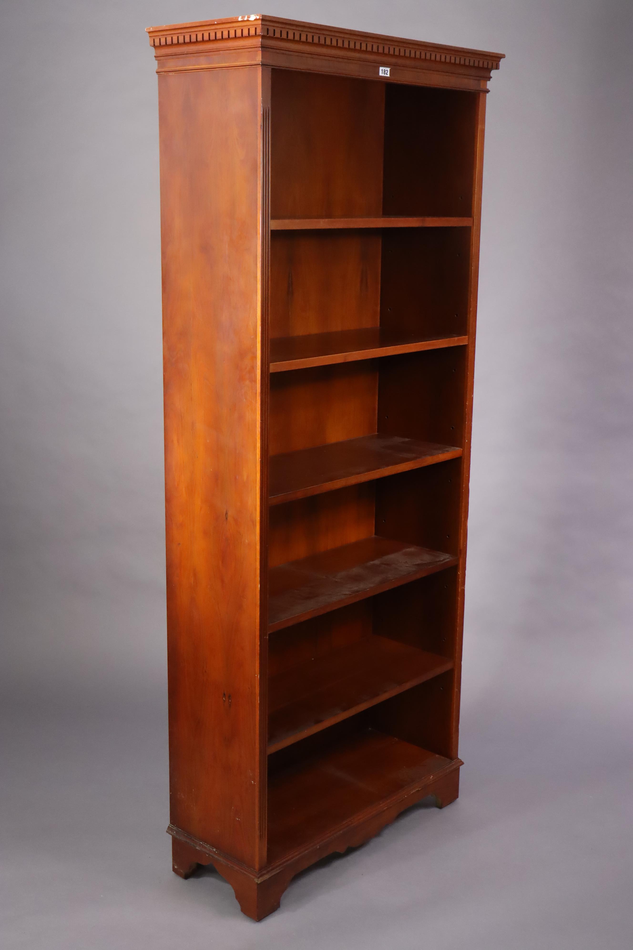 A yew wood tall standing open bookcase with five adjustable shelves, & on a shaped plinth base, 76. - Image 4 of 6