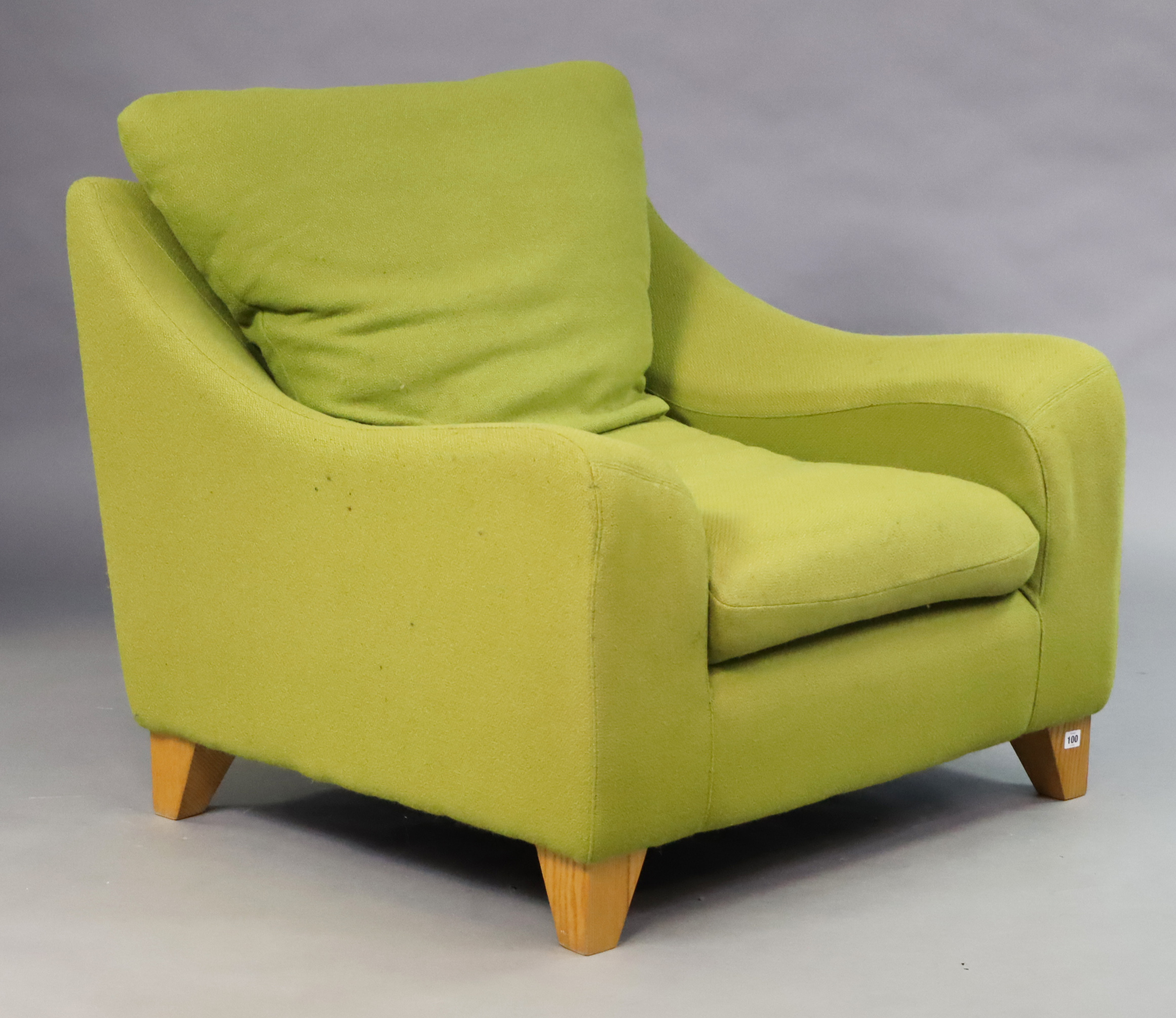 A modern Heals-style large armchair with loose cushion to the seat & back upholstered pale green