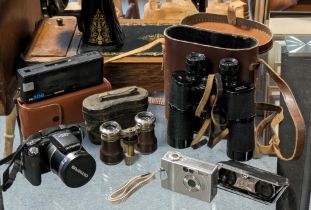 A pair of Lieberman & Gortz binoculars; a pair of opera glasses, both cased; & various cameras &