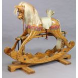 A pine rocking horse with a horse-hair mane & tail, & on a trestle base, bears label “Ian Armstrong,