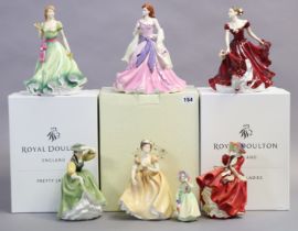 A Coalport bone china figure “Olivia”, 23.5cm high; & six various Royal Doulton female figures,