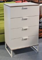 A white-finish upright chest fitted four long drawers, & on short square legs with plain stretchers,