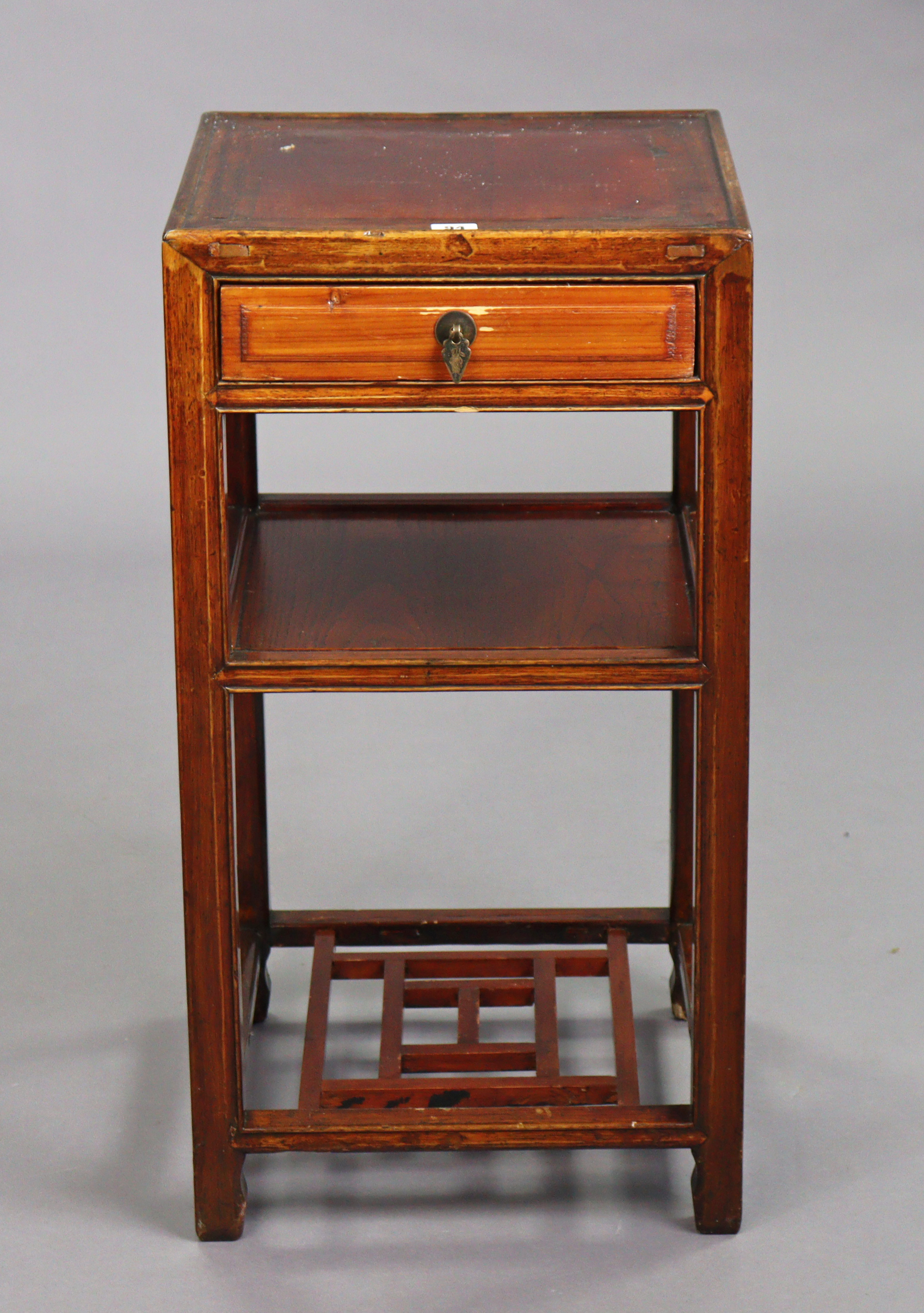 A Chinese hardwood square three-tier occasional table fitted frieze drawer to the upper tier, & on