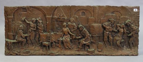 A bronzed composition wall plaque depicting numerous 18th century figures in an Inn interior in