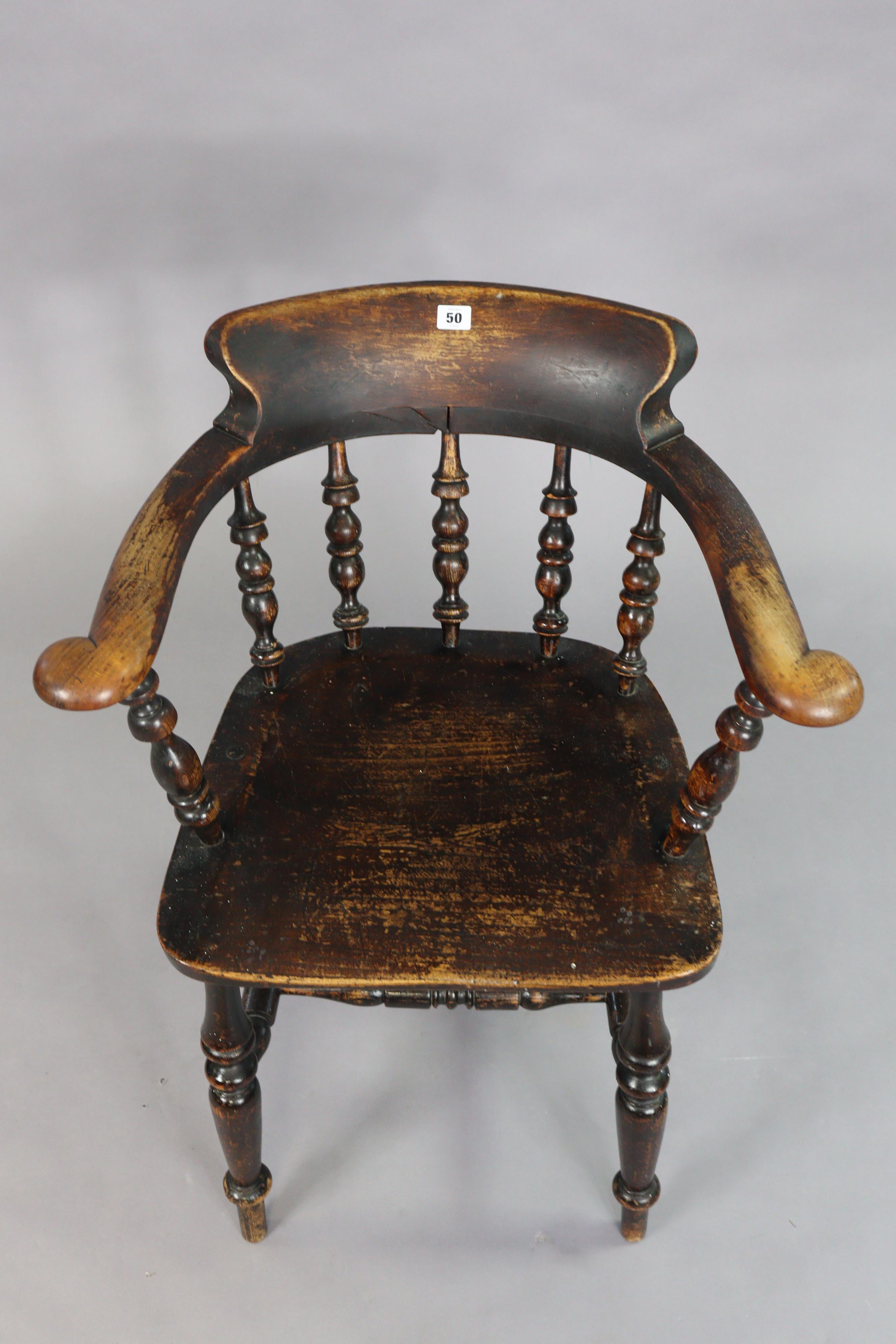 A spindle-back captain’s chair with a hard seat, & on four turned legs with spindle stretchers. - Image 3 of 5