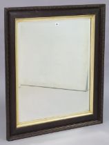 An Edwardian large oak frame rectangular wall mirror, with a carved egg & dart border, & inset