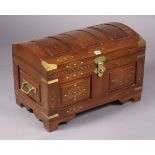 An eastern-style teak brass-bound & brass-inlaid domed-top blanket box with a hinged lift-lid, &