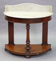 A Victorian mahogany duchess marble-top washstand on a turned front support, & with a shaped open