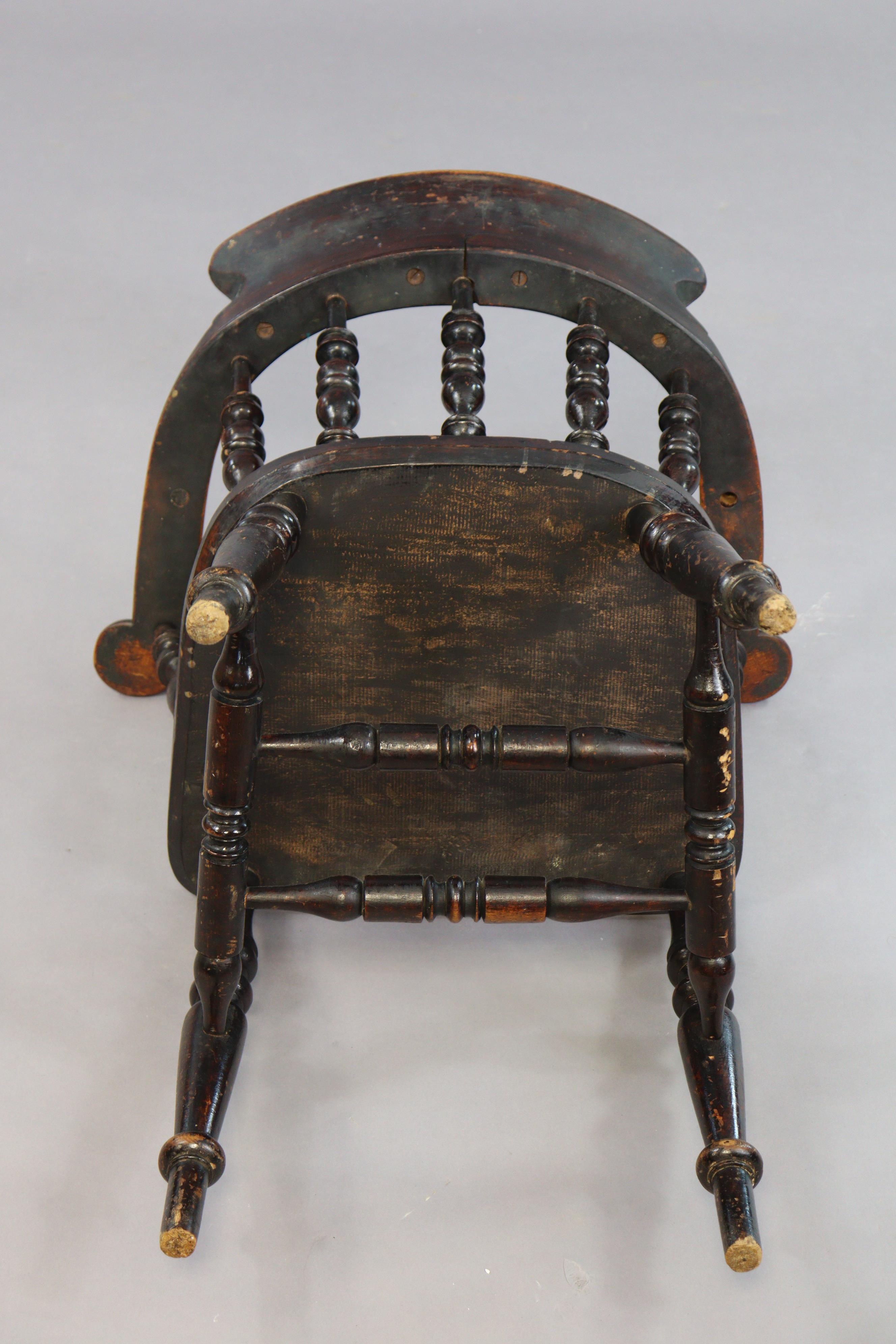 A spindle-back captain’s chair with a hard seat, & on four turned legs with spindle stretchers. - Image 5 of 5