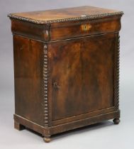 A 19th century continental small walnut side cabinet having a beaded edge, fitted frieze drawer