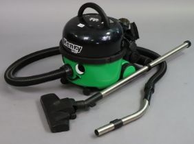 A Numatic “Henry Pet” vacuum cleaner.