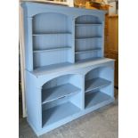 A pale blue painted pine dresser the upper part with five adjustable shelves & with a panelled back,