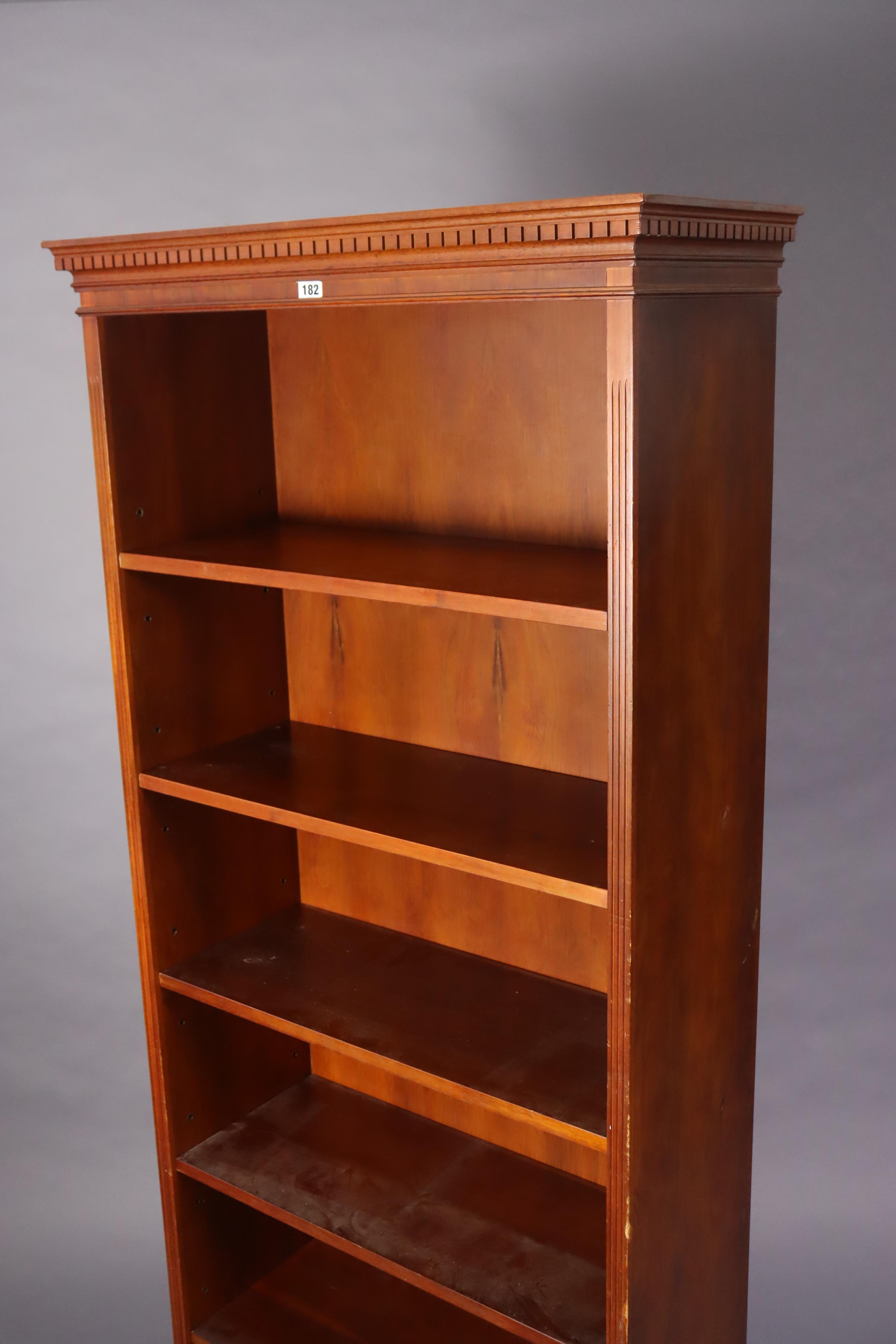 A yew wood tall standing open bookcase with five adjustable shelves, & on a shaped plinth base, 76. - Image 3 of 6