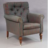 A Victorian-style square back armchair upholstered red & blue stripped material, & on turned legs