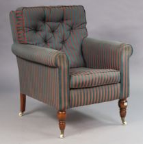 A Victorian-style square back armchair upholstered red & blue stripped material, & on turned legs