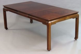 A Chinese-style oak extending dining table in the traditional-style having a rectangular top, two