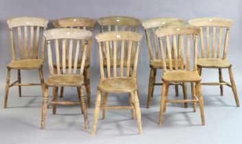 A set of eight lath-back kitchen chairs each with a hard seat, & on four turned legs with spindle