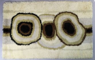 A 1960’s Ege Rya (Danish) ‘De Luxe’ wool rug of cream ground with abstract design to centre,