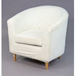 An Ikea tub-shaped chair upholstered off-white material, & on four round tapered legs.