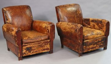 A pair of 1940s tan leather club armchairs on block feet (upholstery heavily worn).