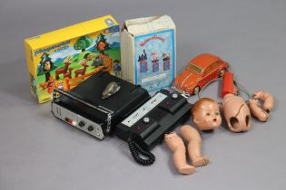 A vintage Videotronic TV game; a Sport Vision 1000 game; a composition doll & various other toys.