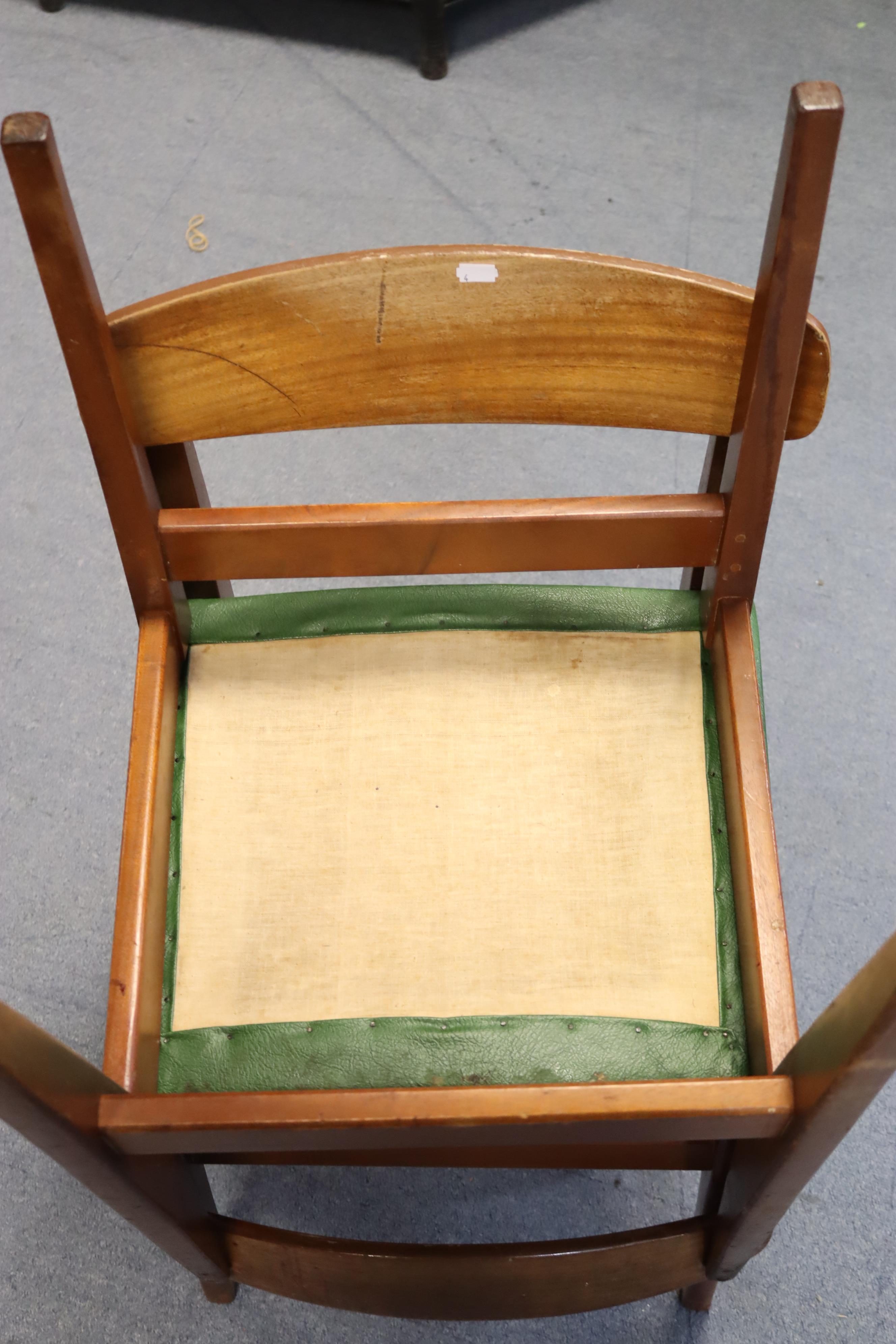 A mid-20th century teak dining room suite comprising of a circular extending table with a centre - Image 4 of 13