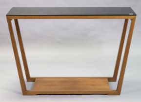 A Calligaris (Italian) teak rectangular side table inset with a smoked-glass top, on square supports