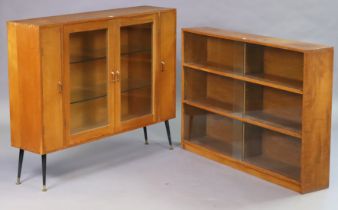 A light oak side cabinet fitted two plate-glass shelves enclosed by a pair of glazed doors,