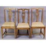 A set of three 19th century oak splat-back dining chairs each with a padded drop-in-seat, & on