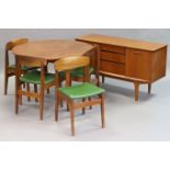 A mid-20th century teak dining room suite comprising of a circular extending table with a centre