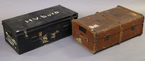 A black japanned-metal travelling trunk with a hinged lift-lid & with wrought-iron side handles,